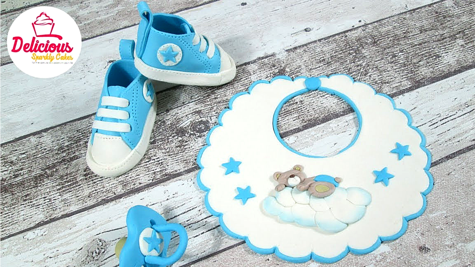 Bib, Dummy and Converse Shoes out of fondant for a Christening Cake